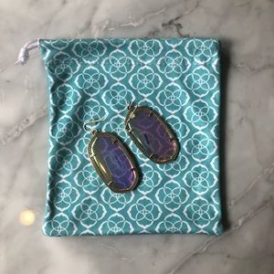 The class is Kendra Scott earrings in iridescent.